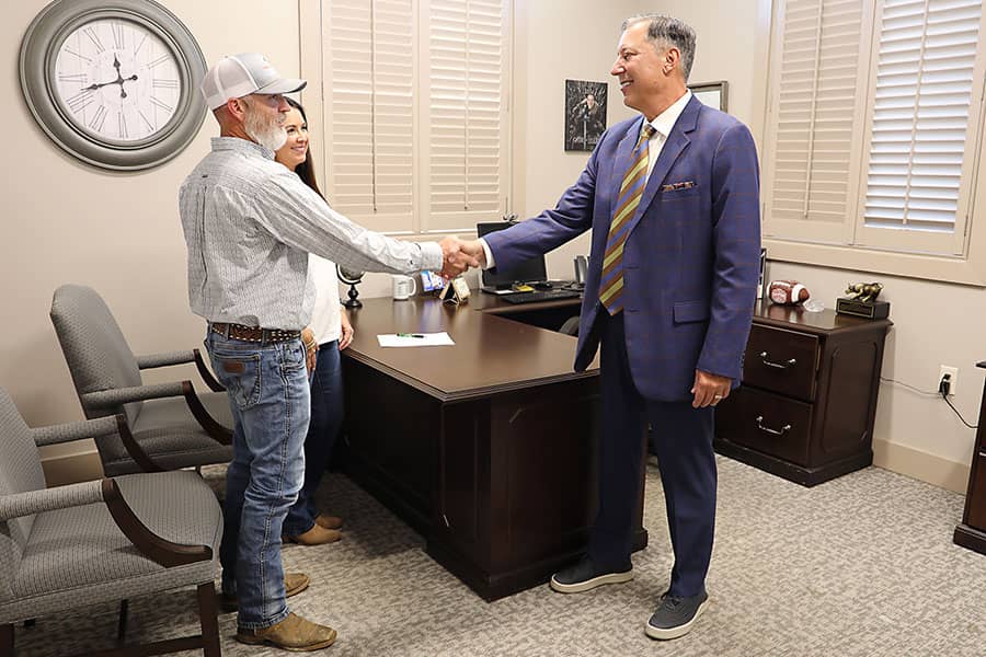 A banker shaking hands with a customer