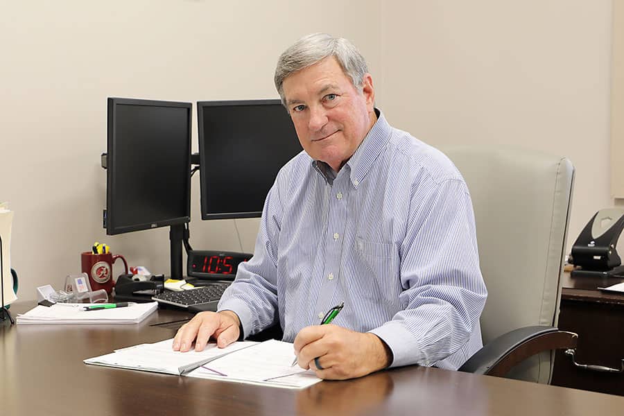 A banker working at her desk with a customer