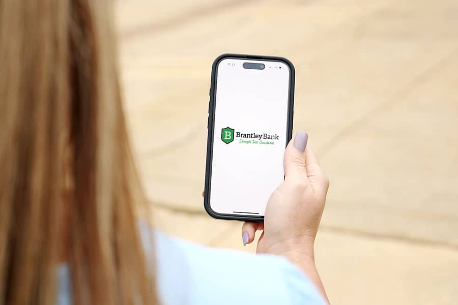 A hand holding a mobile phone